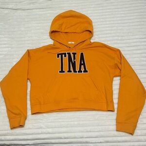 Aritzia TNA Light Orange Cropped Hoodie